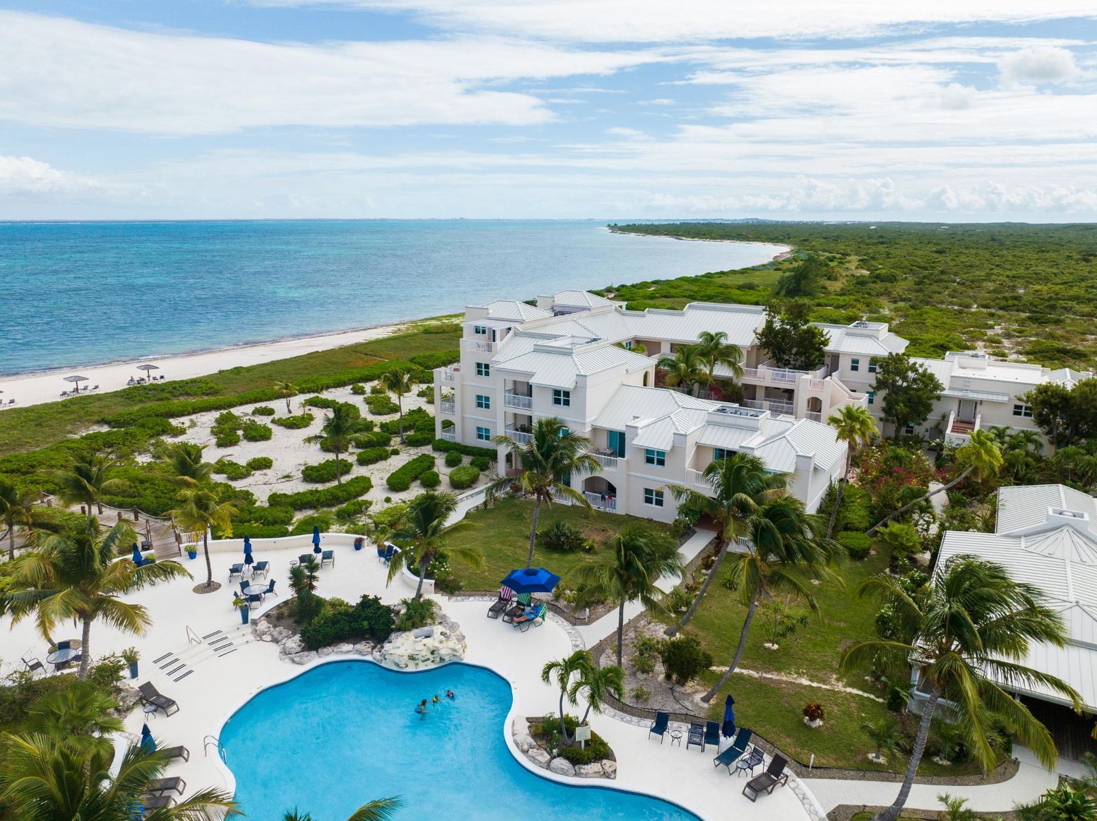Northwest Point Resort from the air with the pool and the beach beyond